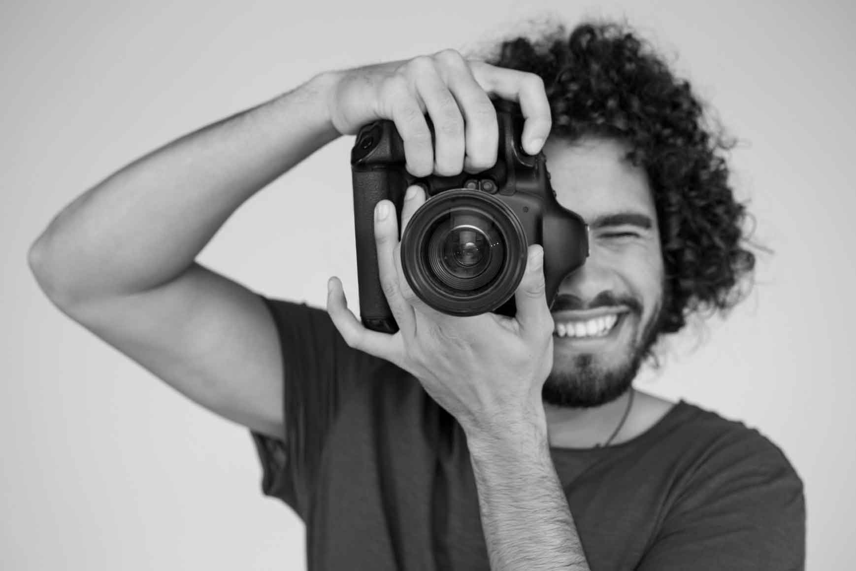 photographer with digital camera in studio J2T42R9